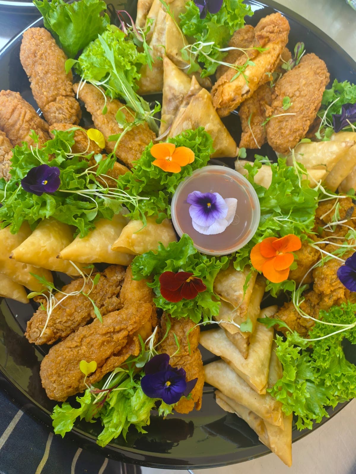 Savoury platter dressed with edible blooms